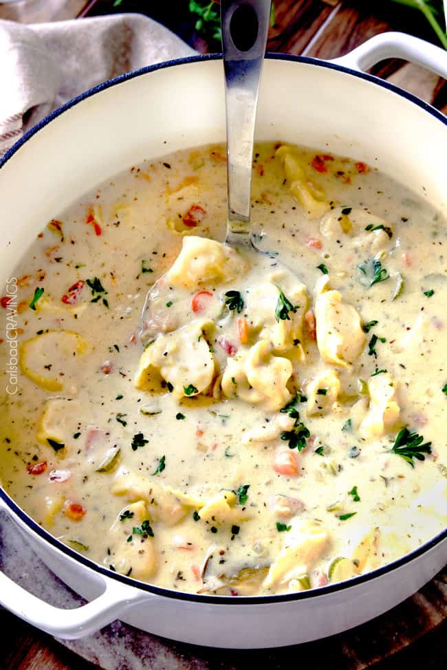 hearty, cozy, Creamy Ham, White Bean Tortellini Soup simmered with onions, carrots, celery and seasonings is SO easy and lick your bowl delicious! love the addition of cheesy tortellini!