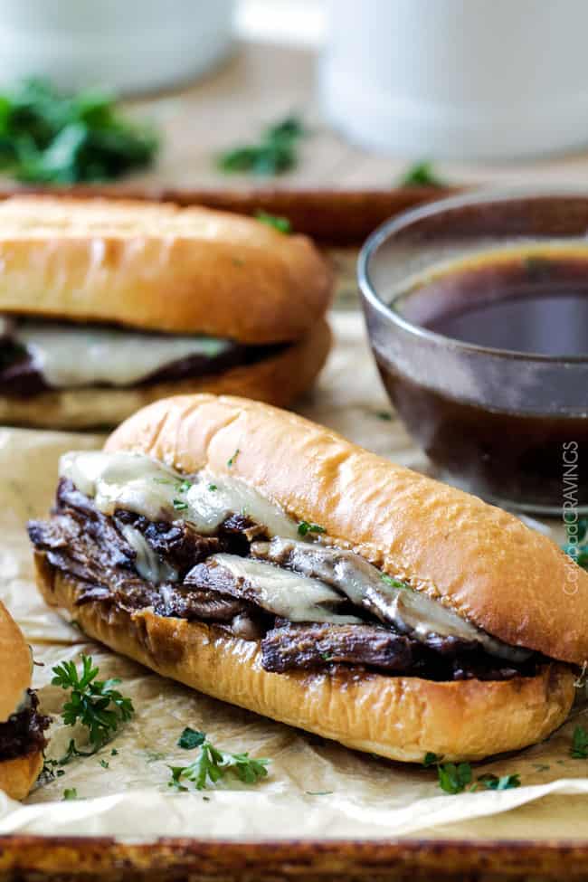 5 minute prep Crazy tender Slow Cooker French Dip Sandwiches seeping with spices are unbelievably delicious and make the easiest dinner or party food. You haven't had French Dip Sandwiches until you try these! absolutely the best!